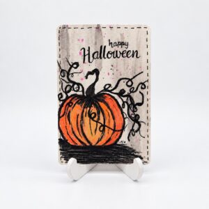Aquarelkaart Pompoen vol krullen van By Mieke met oranje pompoen, zwarte sierlijnen en de tekst Happy Halloween.